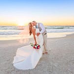 couple kissing by beach